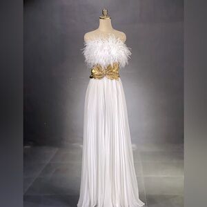 White party evening mini dress with a strapless design and chiffon fabric.